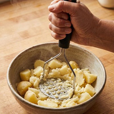 PRESS-PUREE-INOX-FORME-U-MANCHE-NOIR
