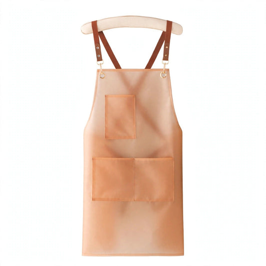 Tablier de cuisine FlexiApron Orange en TPU translucide sur fond blanc, bretelles croisées et 3 poches